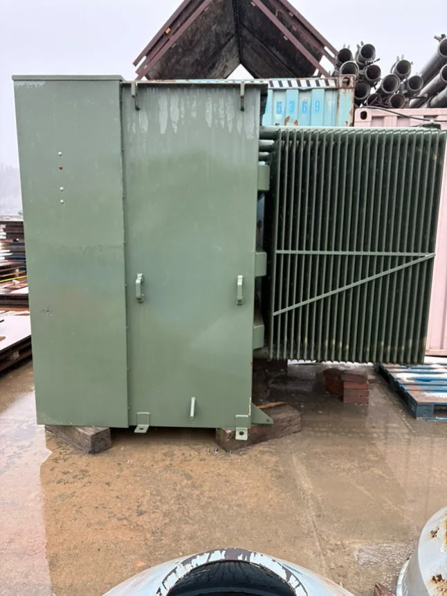 Pad-mounted transformer near an industrial facility